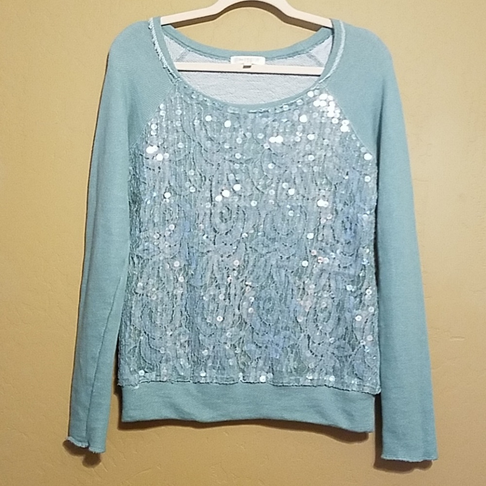Love Fire sweatshirt with sequence and lace layer.